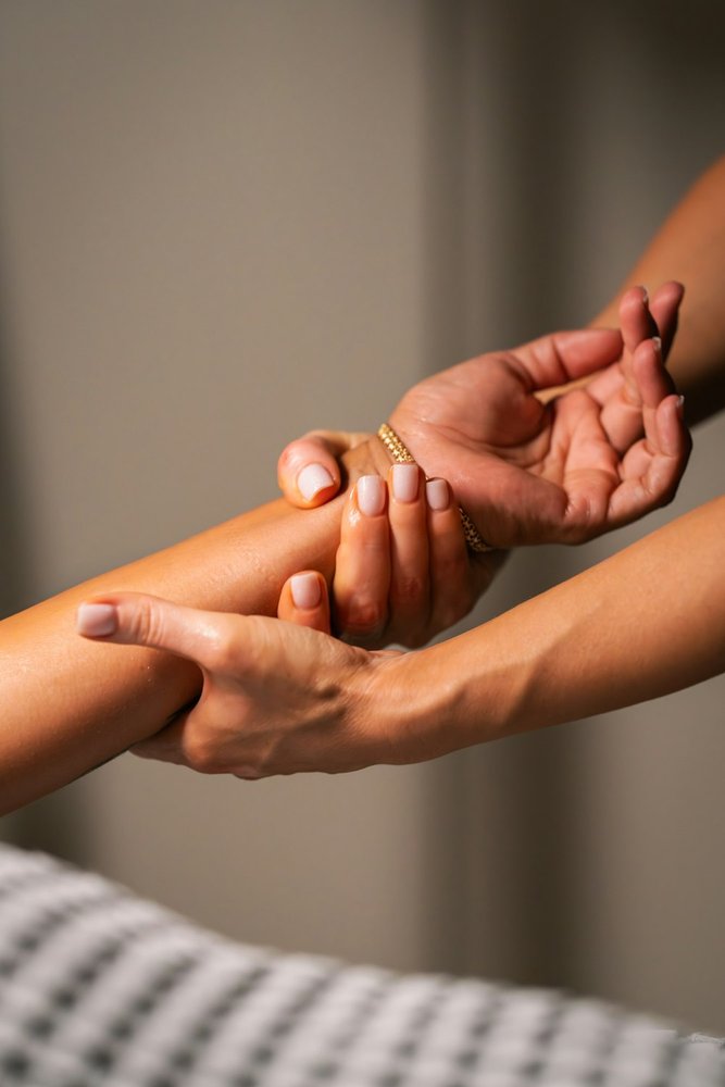 Close-up of hands-on therapeutic care at SOMA Active Health